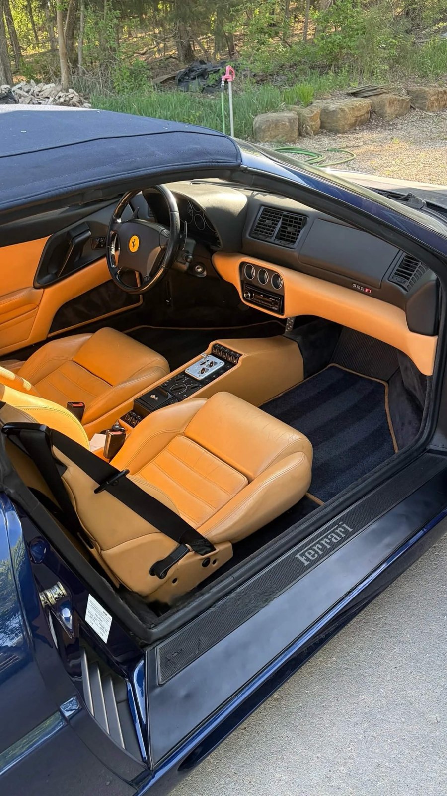 Ferrari 355 F1 spider with tan leather seats and dashboard cleaned and conditioned during a collector car detail