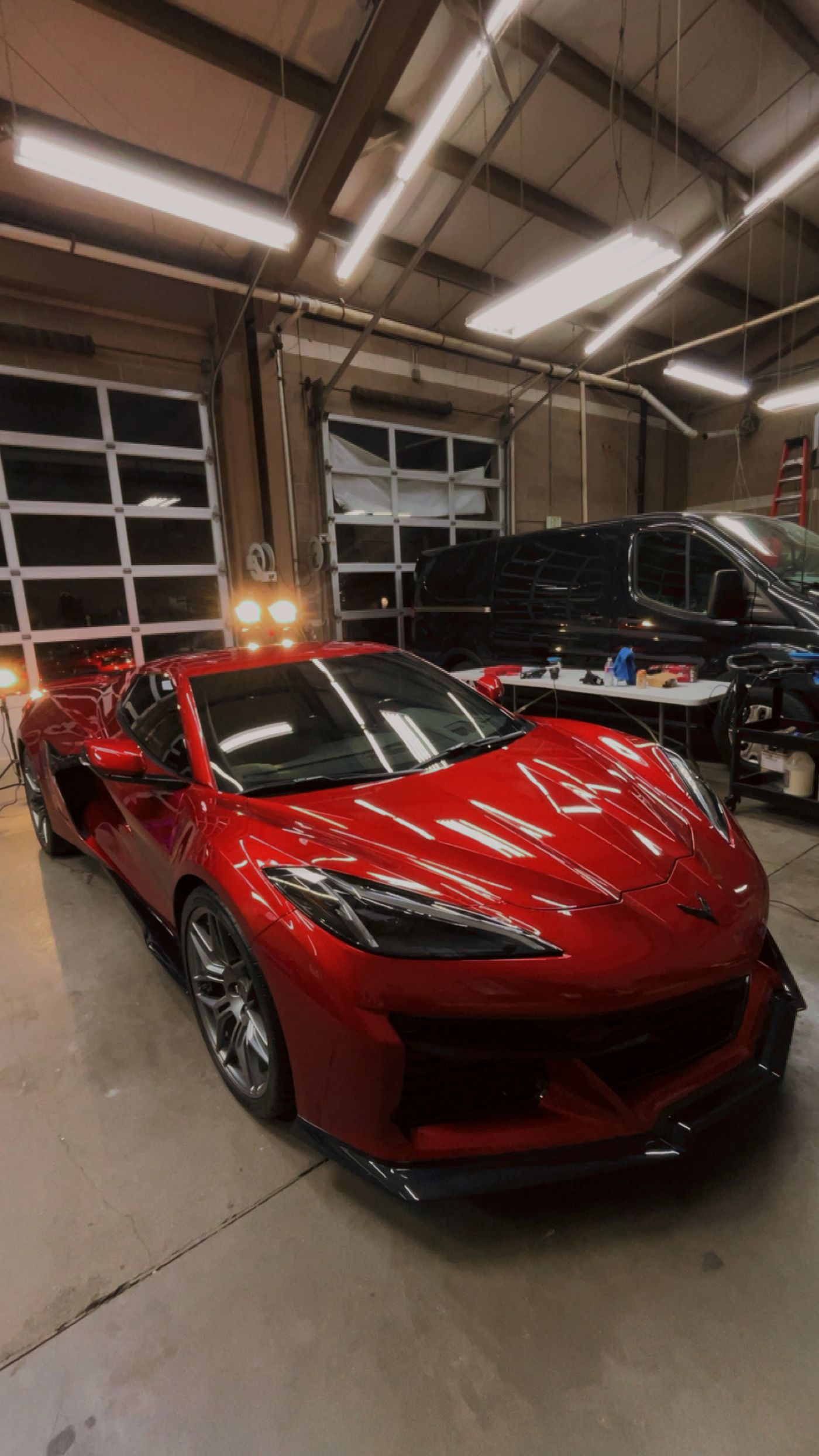 Red Chevrolet Corvette Z06 with a deep mirror-gloss finish after paint correction