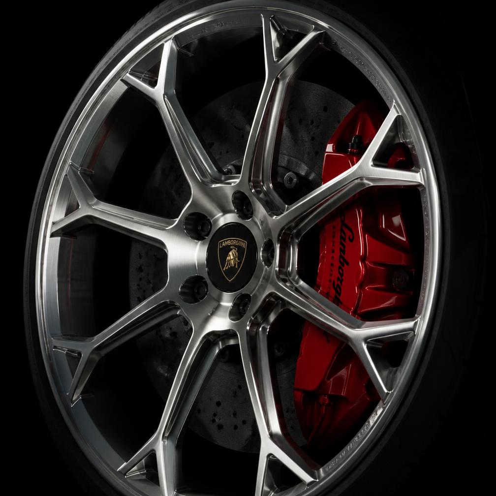 Polished forged supercar wheel with red brake caliper after full decontamination